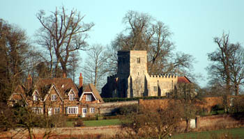 Battlesden church and adjoining house seen from the A5 January 2008